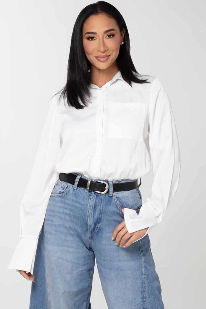 Dr. Sheena Kawamoto smiling in a studio portrait