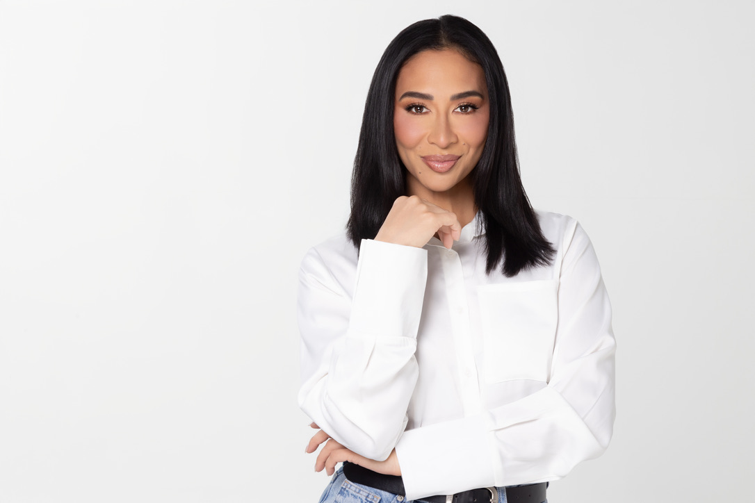 Dr. Sheena Kawamoto in a white blouse, studio portrait